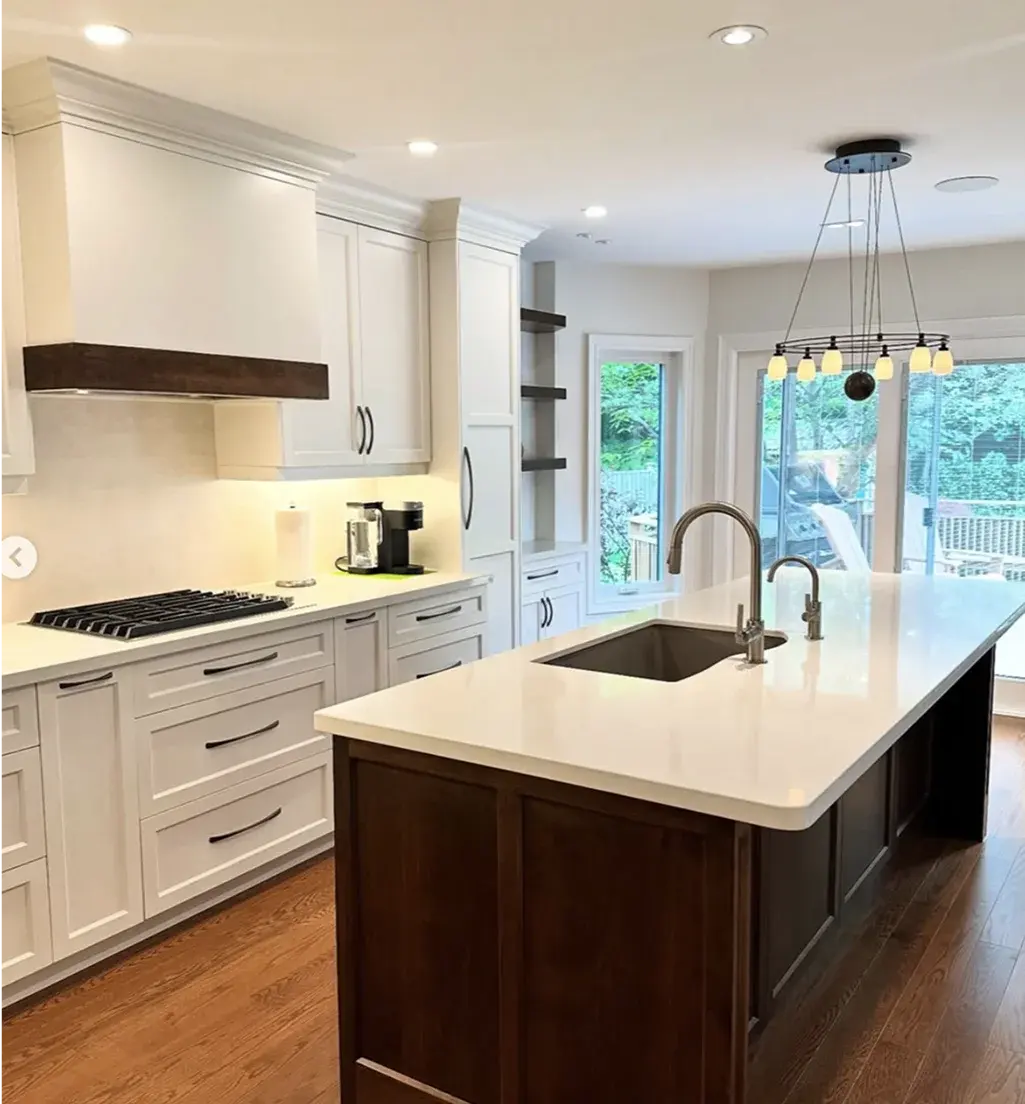 White kitchen with a dark wood island near Etobicoke