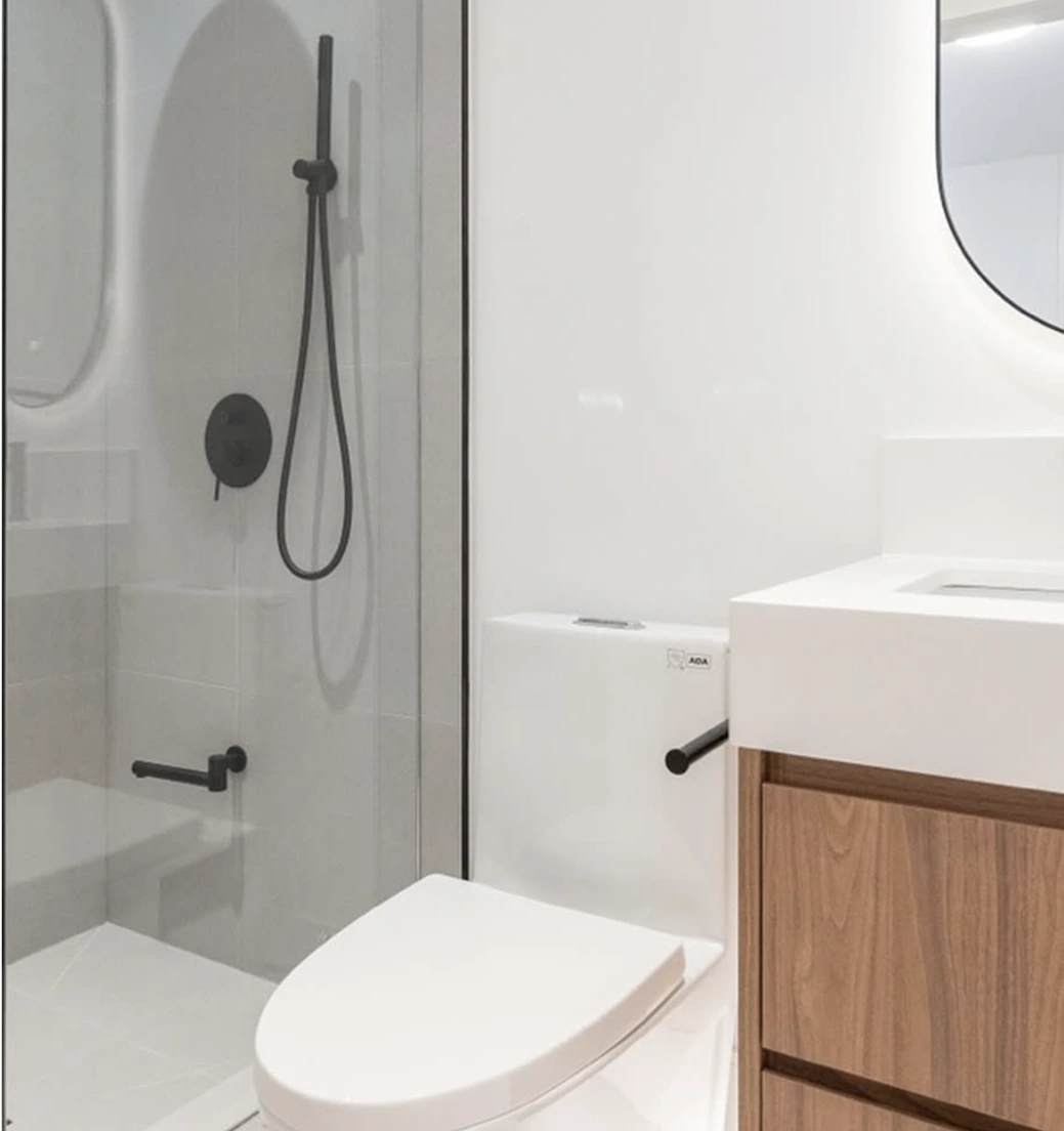 Contemporary bathroom with black fixtures and white minimalist design