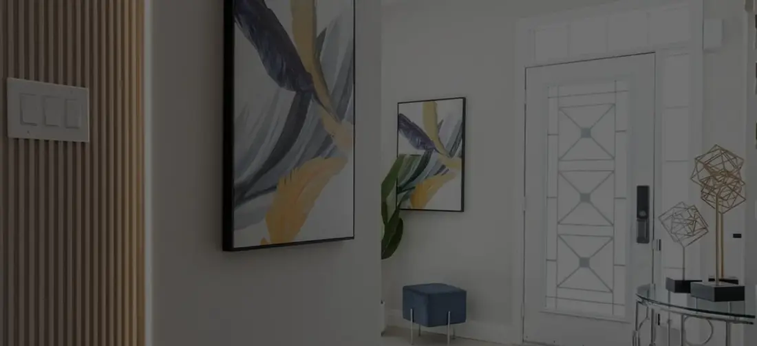 Entry hall with framed artwork and a wood slat wall near Halton Hills