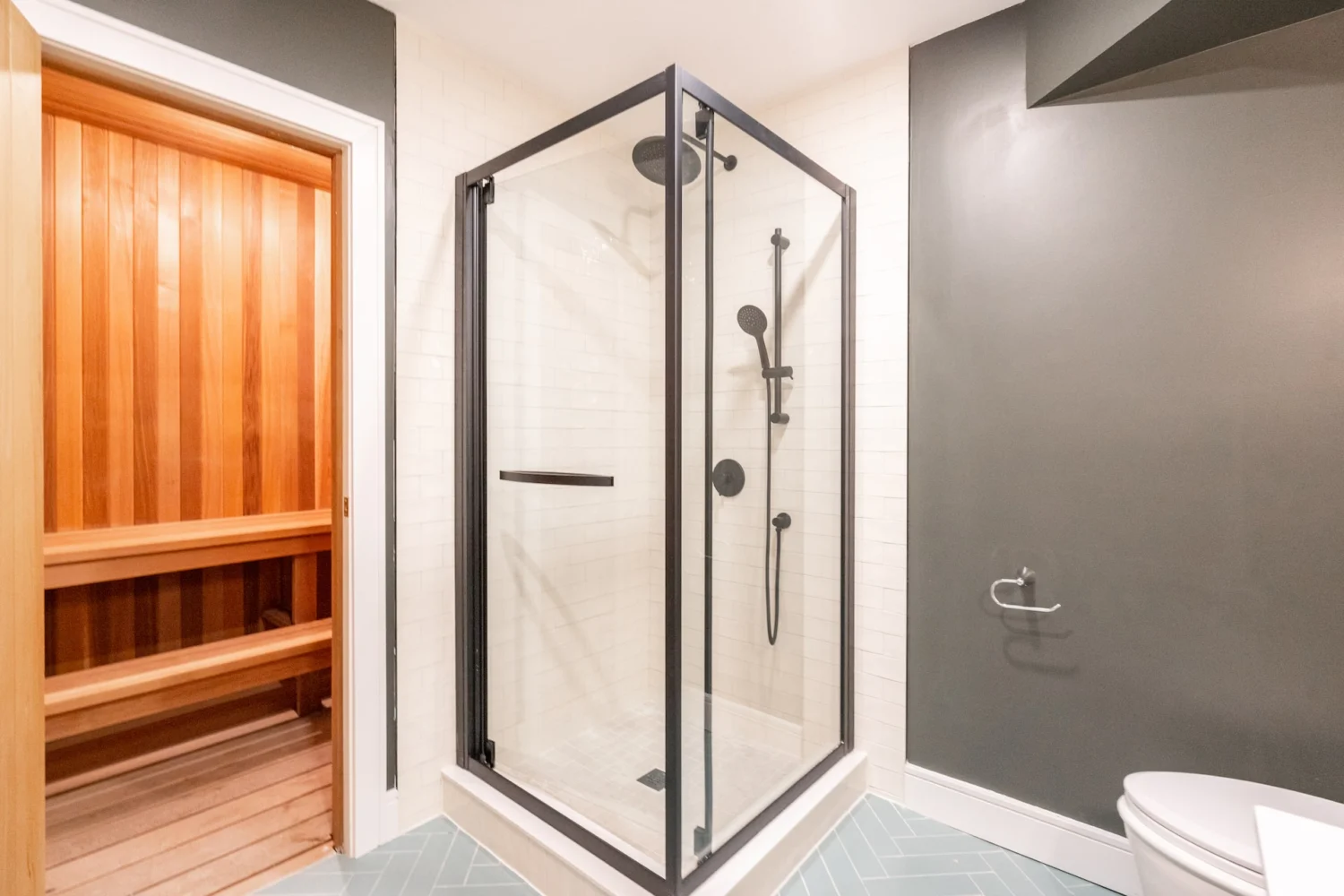 Bathroom with a glass shower and cedar sauna near Markham