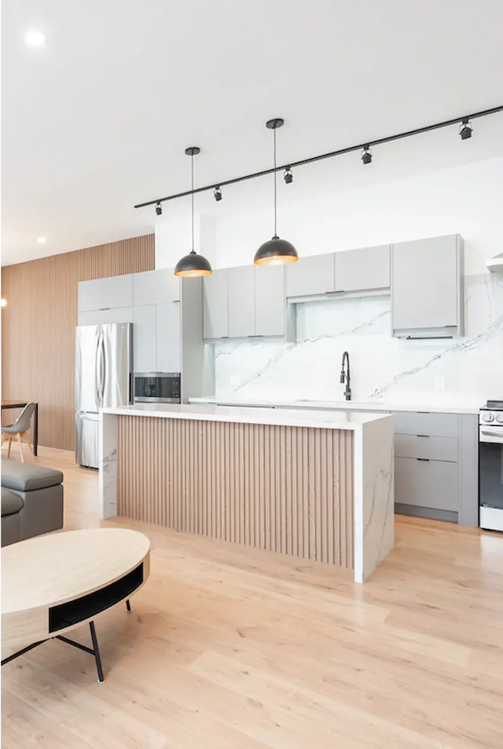 Modern white and wood kitchen with pendant lights in a Waterloo home