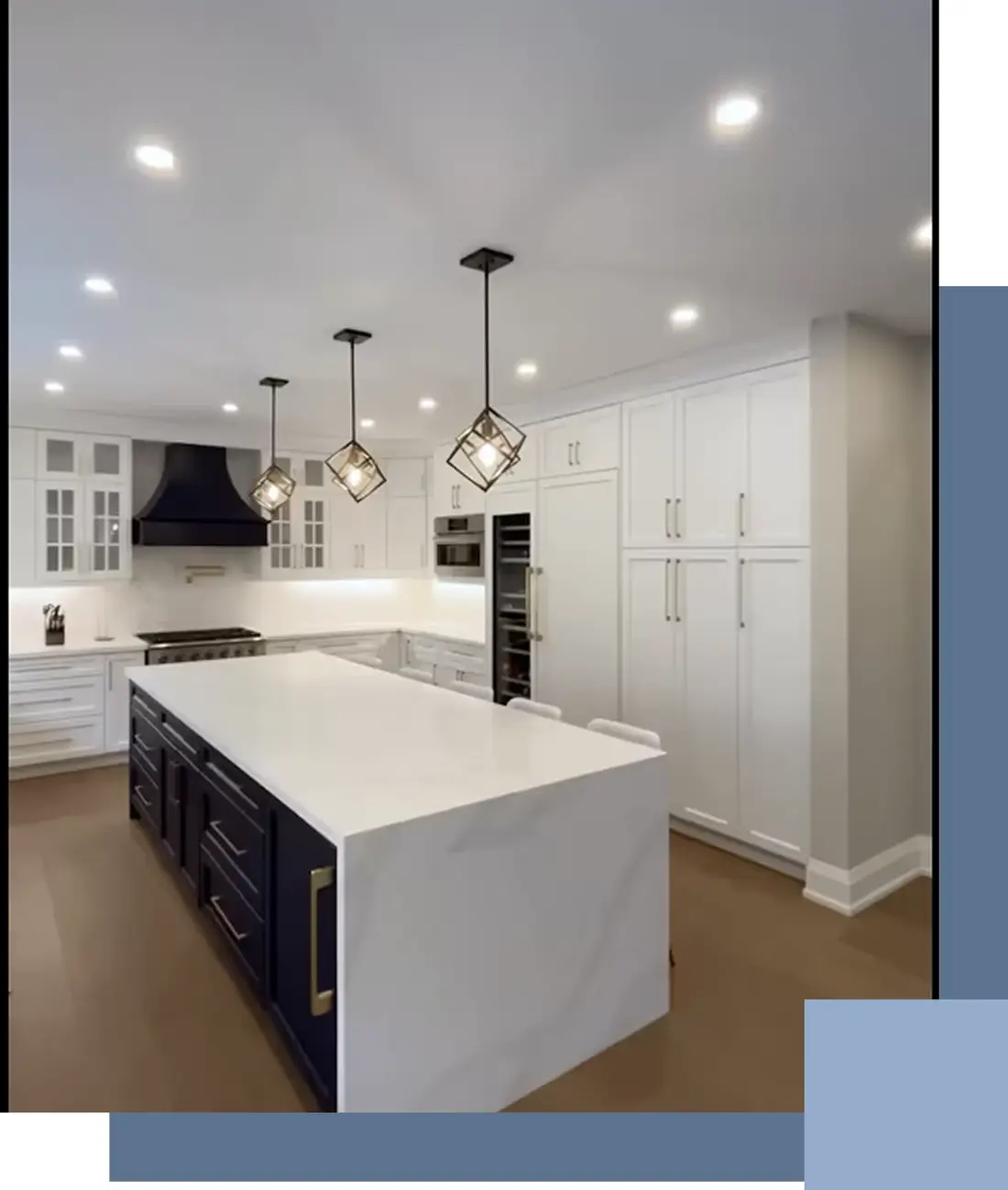White kitchen with a dark island and custom range hood in an Orangeville home