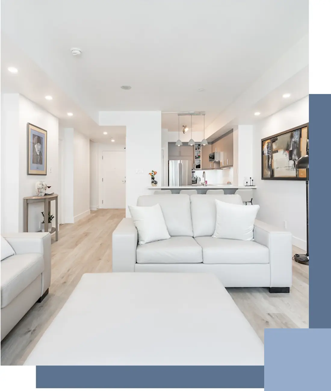 Bright open living room with a white sectional sofa near Pickering