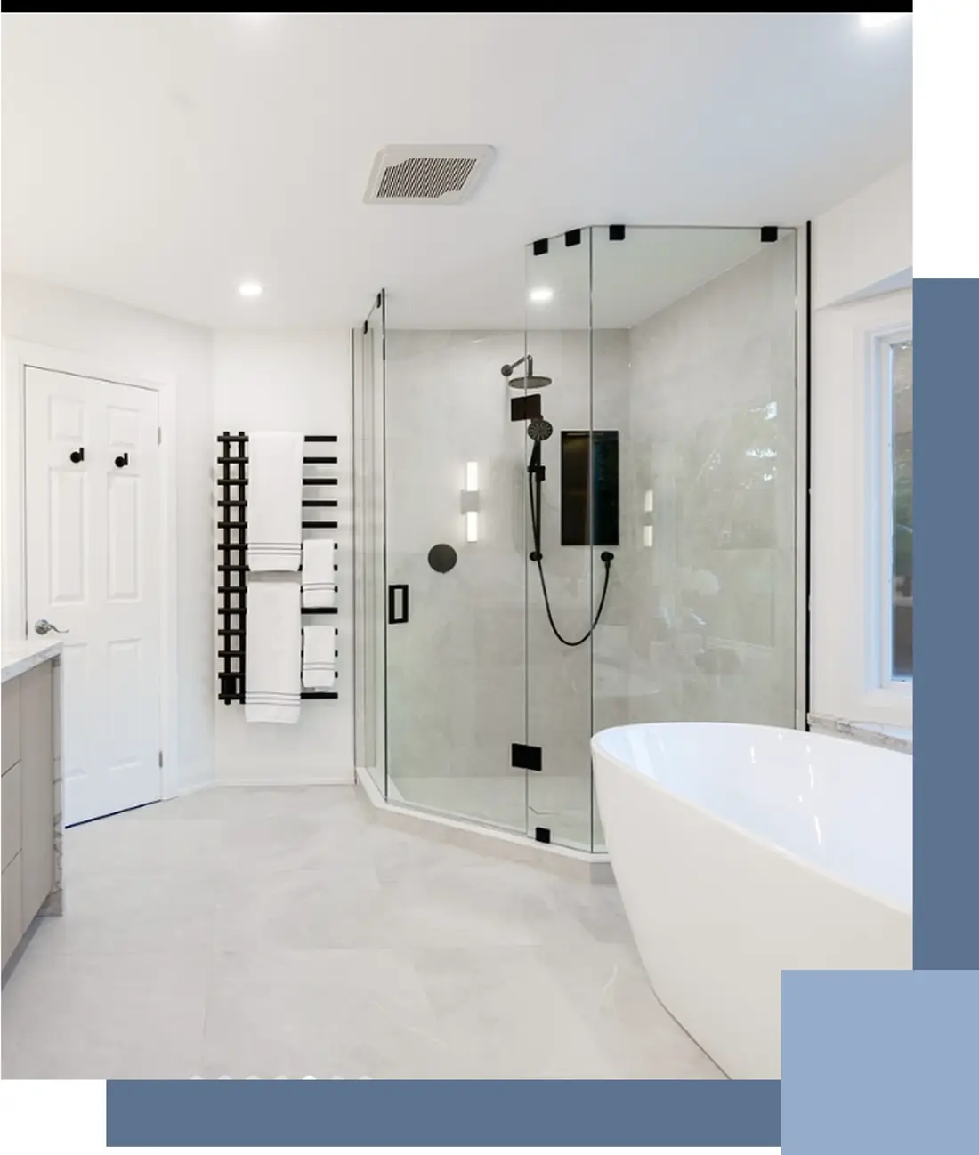 Bathroom with a glass shower and freestanding tub near Whitby