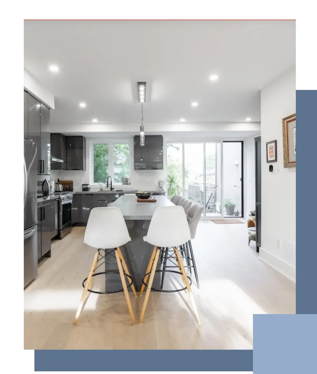 Bright white kitchen opening onto a dining area in a Whitby home