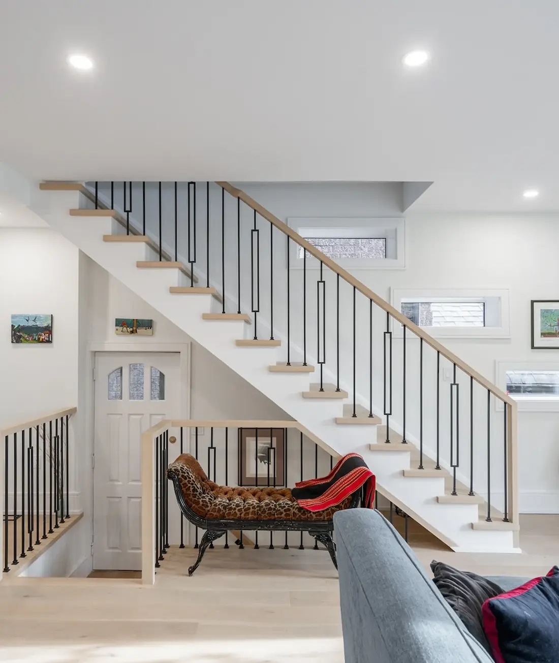 Renovated staircase with a runner and white risers in a Pickering home