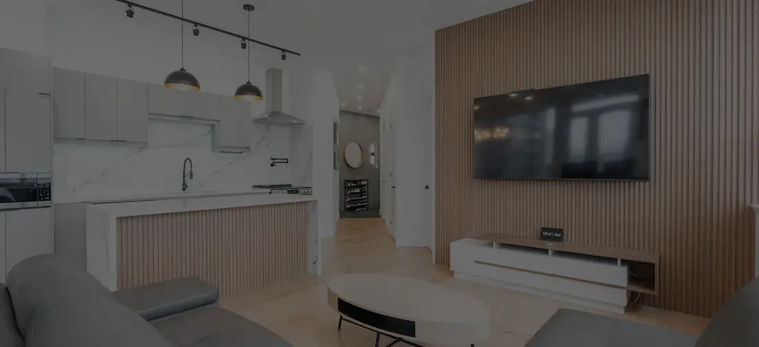 Open kitchen and living area with a wood slat feature wall near Guelph