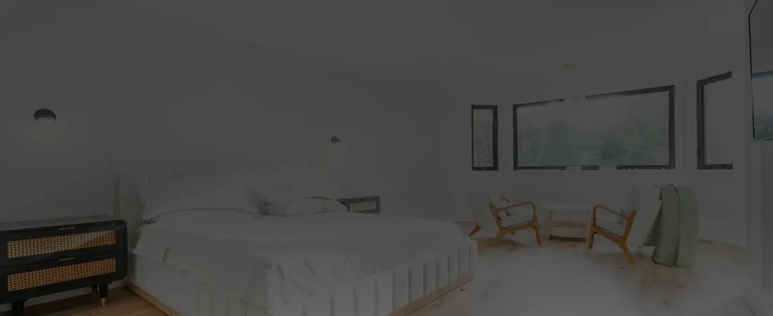 Bright bedroom with large windows and light finishes near Innisfil