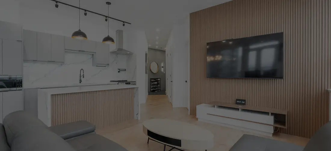 Basement suite living room with a slatted feature wall and an open kitchenette