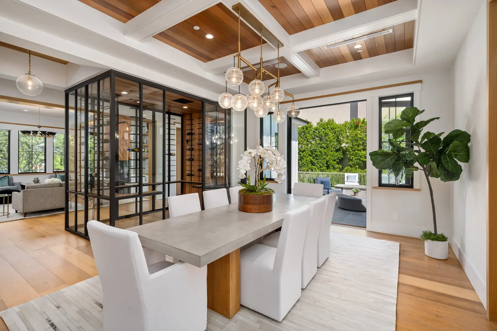 Formal dining room with glass partition in a finished whole-home renovation