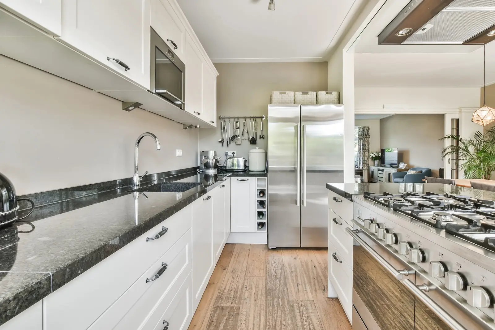 Bright renovated kitchen with stainless appliances and stone countertops
