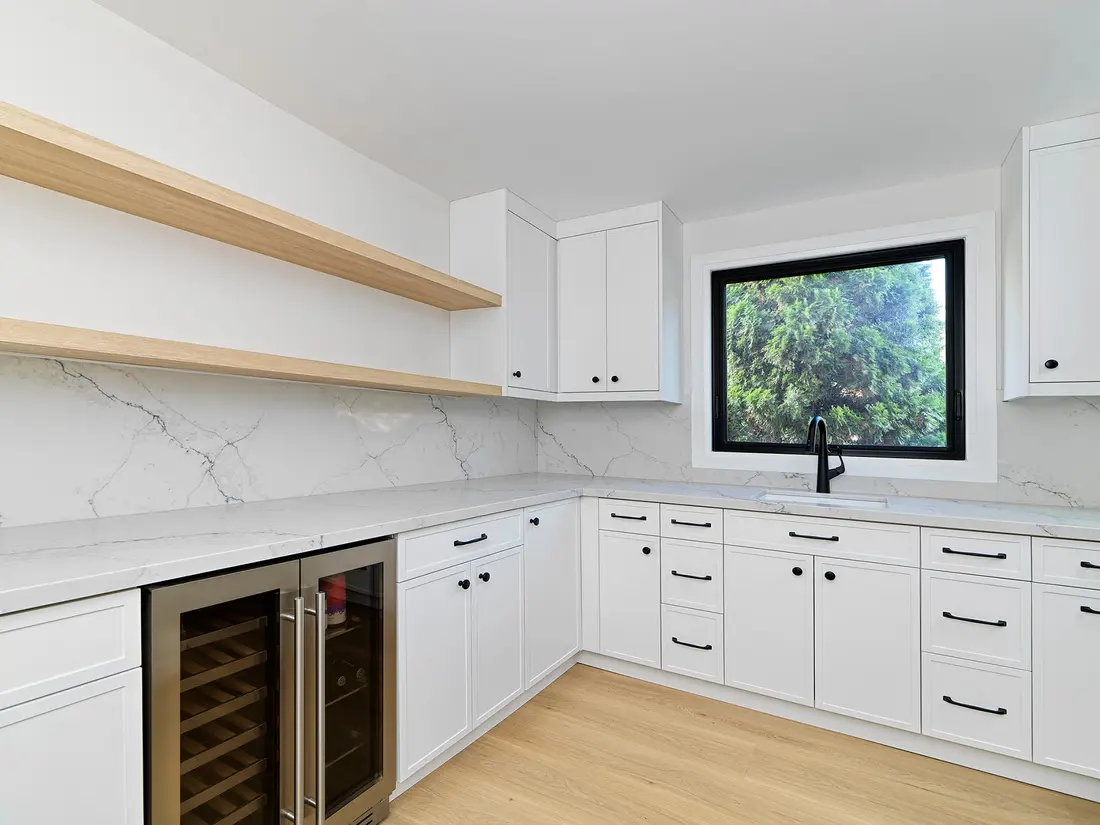 White kitchen with open shelving and marble backsplash near Guelph