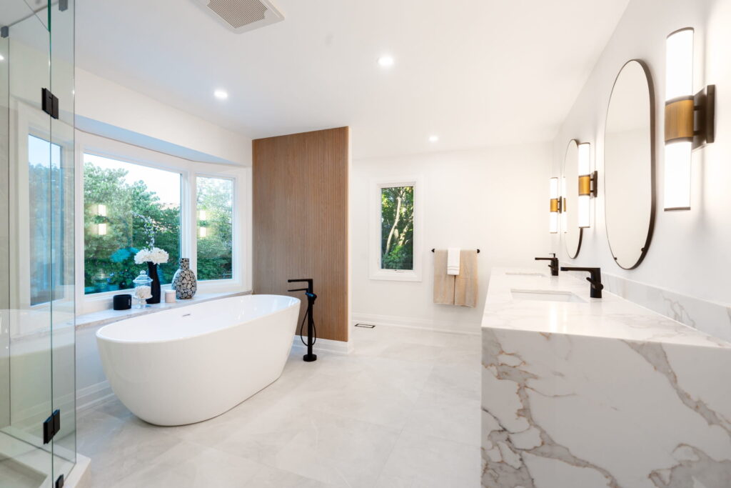 untitled-1 Renovated bathroom with a freestanding soaker tub, marble feature wall and wood vanity